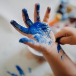 hand with blue paint